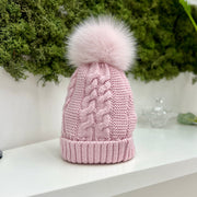 Cappello a trecce con pompon