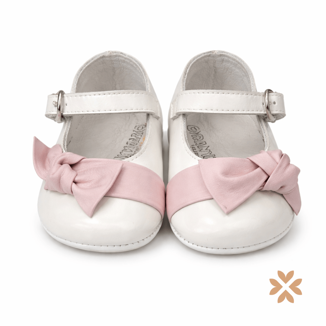 Scarpine culla con fiocco rosa