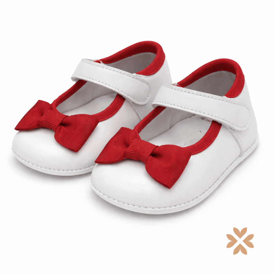 Scarpina bianca con fiocco rosso
