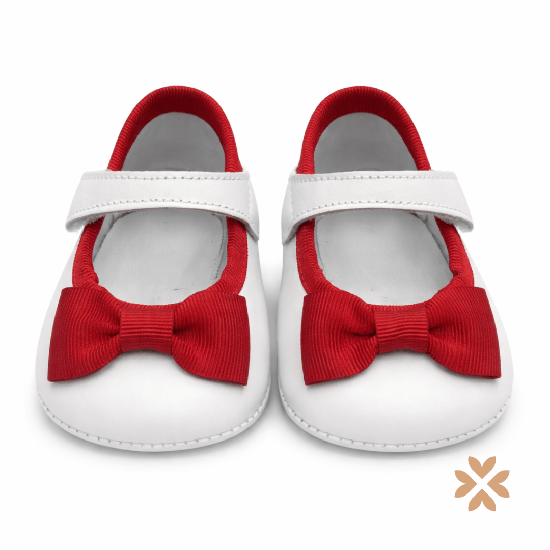 Scarpina bianca con fiocco rosso